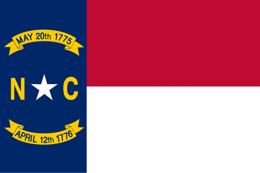 The flag of North Carolina with the date of the Mecklenburg Declaration of Independence and the Halifax Resolves.