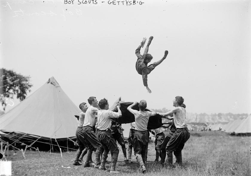 A black and white photo of Boy Scouts at play at the Gettysburg 1913 Reunion