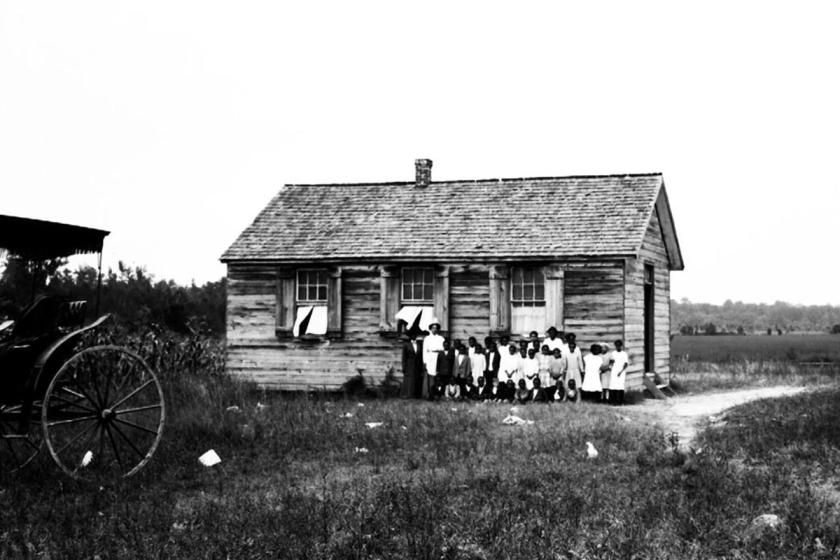 This image, likely from the early 20th century, shows noted educator Virginia Randolph and students outside the school in Gravel Hill.