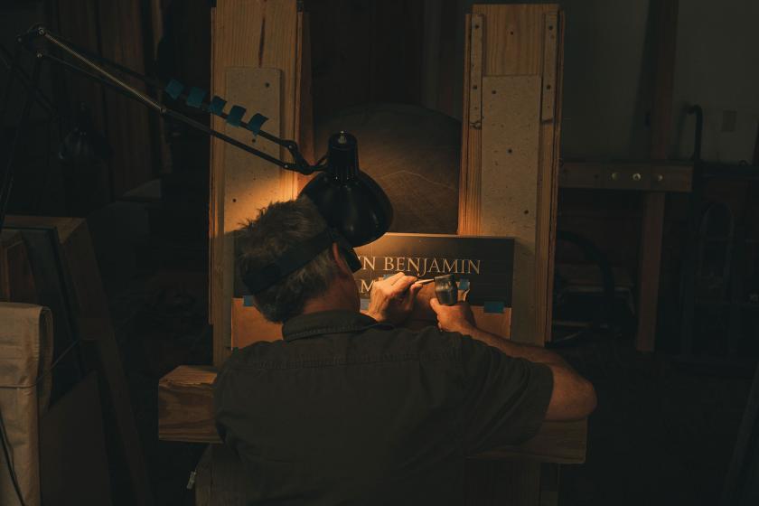 Paul Russo of the John Stevens Shop at work from behind