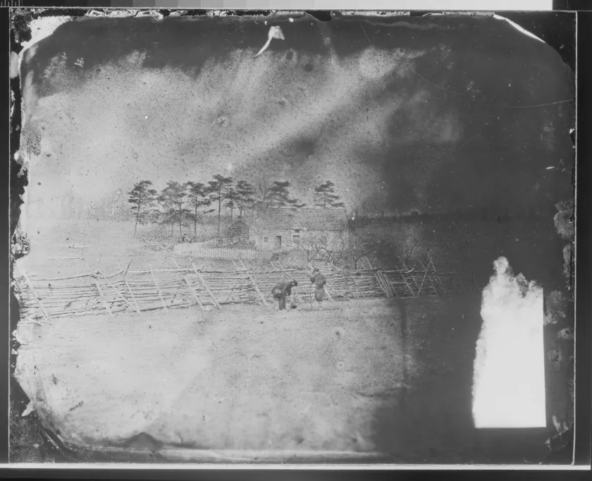 Civil War photograph of Union soldiers on picket duty preparing coffee around a small outdoor fire.