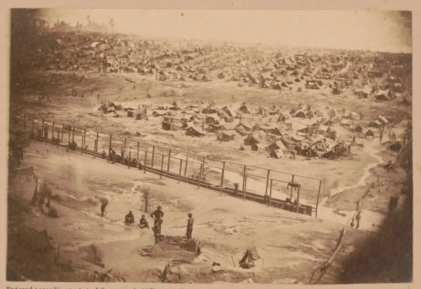 Union prisoners gather roots to use as a coffee substitute while confined at the Confederate prison camp at Andersonville, Georgia.