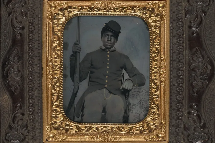 Unidentified African American soldier in Union sergeant uniform holding a rifle