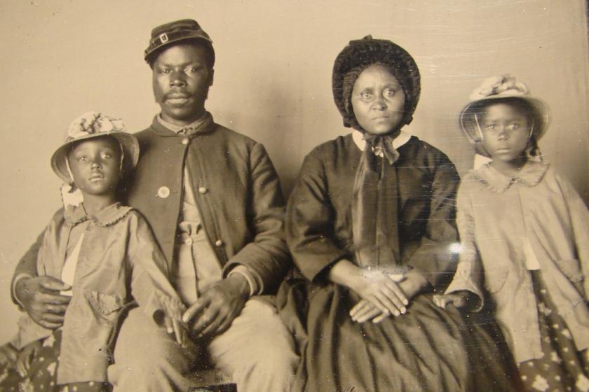 Unidentified African American soldier in Union uniform with wife and two daughters