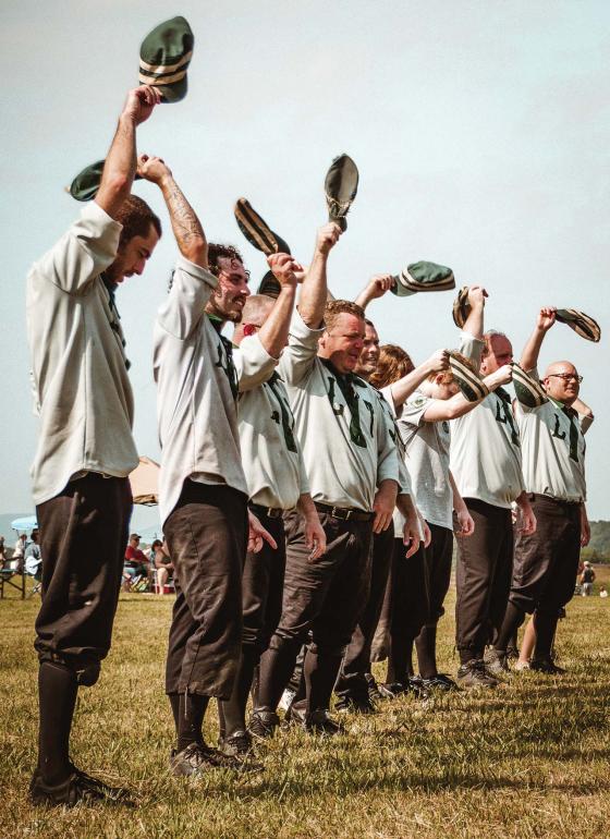 The Lisbon Tunnelmen shout a big cheer and wave their hats