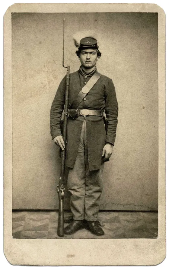 Distinctive Pennsylvania "Bucktail" uniform. Members of this regiment famously attached a real white-tailed deer's tail (a bucktail) to their caps (kepis) or hats as a symbol of their marksmanship and elite status.