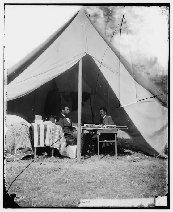Photograph of Lincoln and McClellan seated somewhere at Antietam