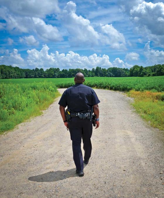 Damon Radcliffe walks along a trail at the Hankins Farm