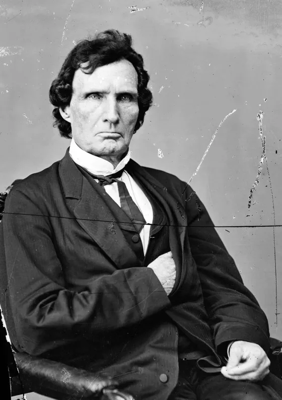 Black-and-white image of a man in a western suit.