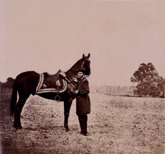 Ulysses S. Grant standing alongside his war horse, "Cincinnati"