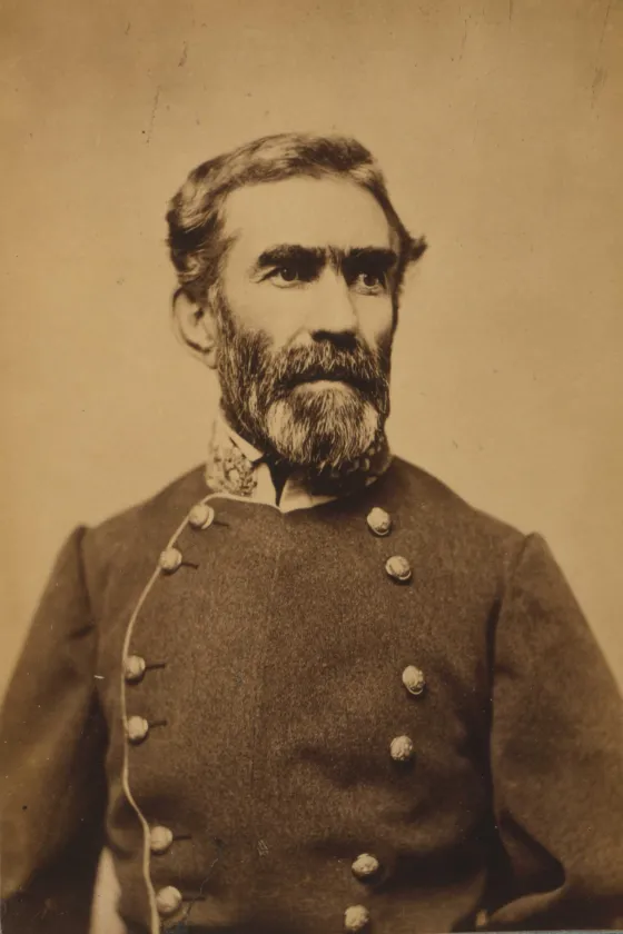 Portrait photograph of Confederate Gen. Braxton Bragg in military uniform, facing to the right.