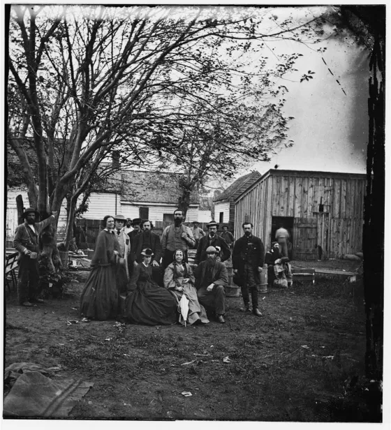 Group portrait of nurses and officers of the United States Sanitary Commission gathered in Fredericksburg, Virginia, during the Overland Campaign.