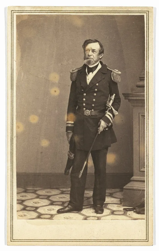 Full-length studio portrait of Union naval officer Andrew Hull Foote wearing his military uniform during the Civil War era.