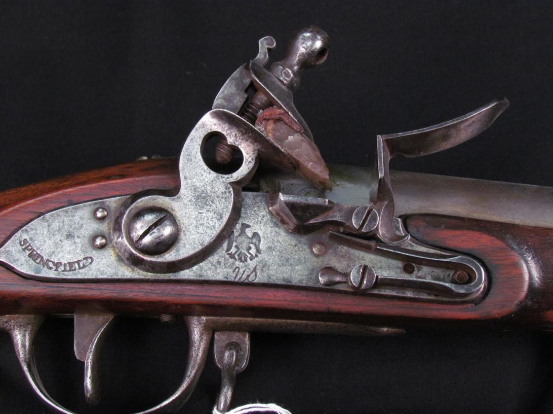 Closeup image of a 1795 Springfield Musket which shows the flintlock mechanism.