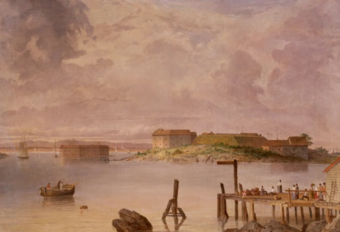 A historic coastal fort sits on a small island across calm water, viewed from a shoreline with a wooden pier and small boats. Dark clouds fill the sky above the stone buildings, while figures gather along the dock in this 19th‑century painting.