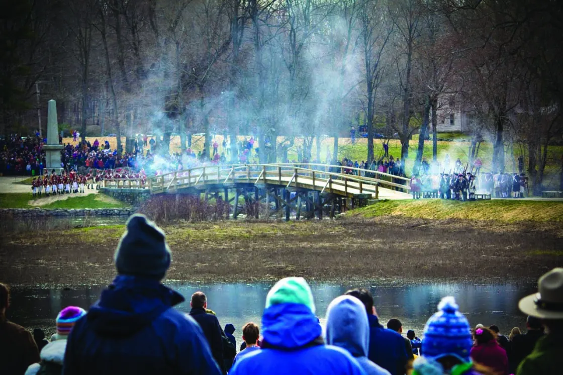 Visitors watching a reenactment at Minute Man National Historical Park in Concord, Mass.
