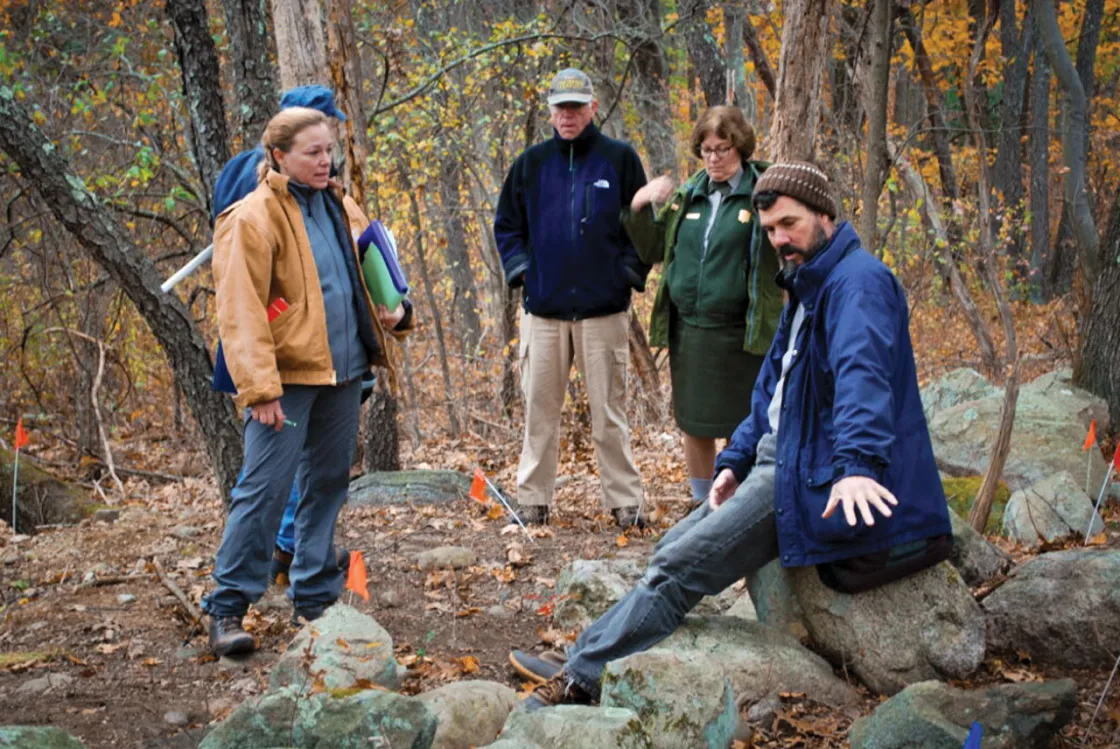 A team of NPS staffers discussing their finds at “Parker’s Revenge”