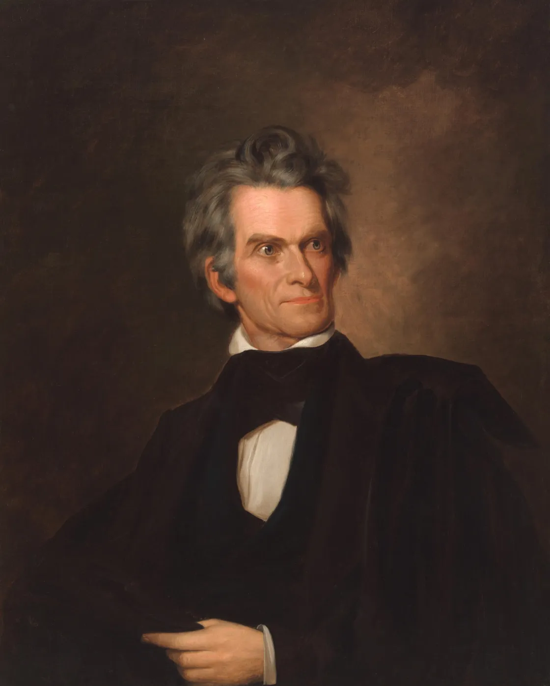 Oil portrait of John C. Calhoun seated in a chair, wearing a dark coat and black cravat.