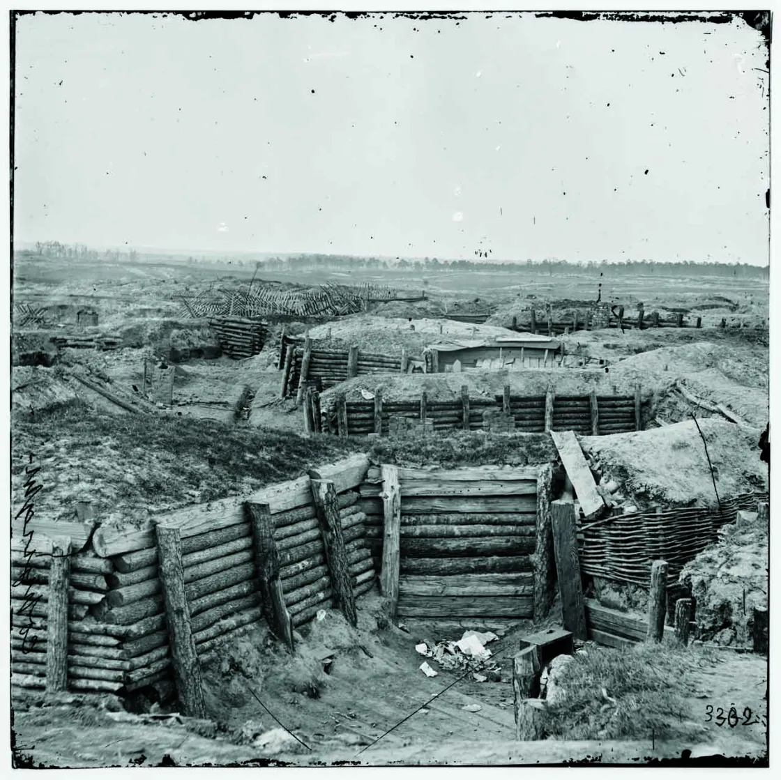 Confedarate fortifications after the Siege and Battle of Petersburg with chevaux-de-frise in the background.