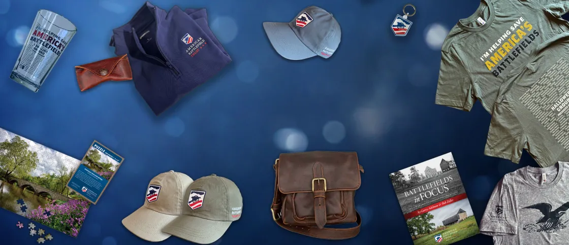 A selection of products sold in the Trust store, including shirts, glasses, books, bags and hats
