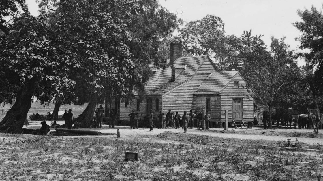 Photo shows soldiers and tents at the Cold Harbor Tavern.