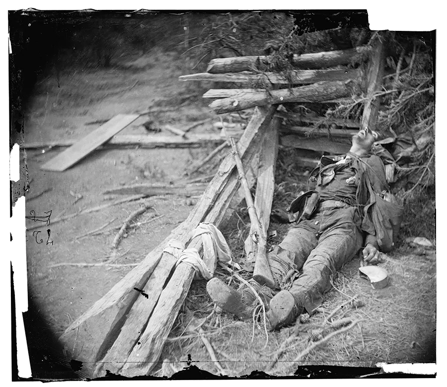 This photograph shows a soldier lying dead in the rubble of Spotsylvania.