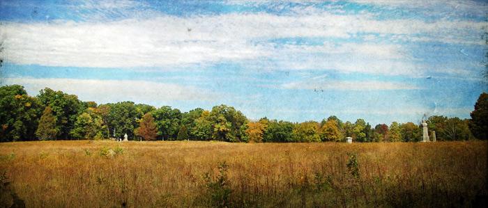 A landscape photograph of a golden wheat field at Gettysburg