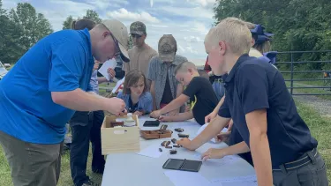 Kids putting their printing press skills to the test at the Culpeper Generations Event