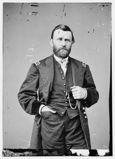 Studio portrait of Ulysses S. Grant seated in military uniform.